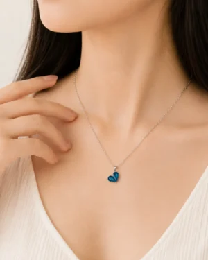 Ocean Gem Heart Pendant Necklace featuring a sparkling blue heart crystal on a premium silver chain