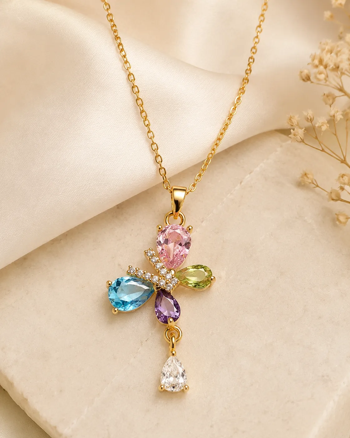 Butterfly Blossom Crystal Necklace Butterfly Blossom Crystal Necklace featuring pink, blue, green, purple and white crystals in a gold floral butterfly pendant