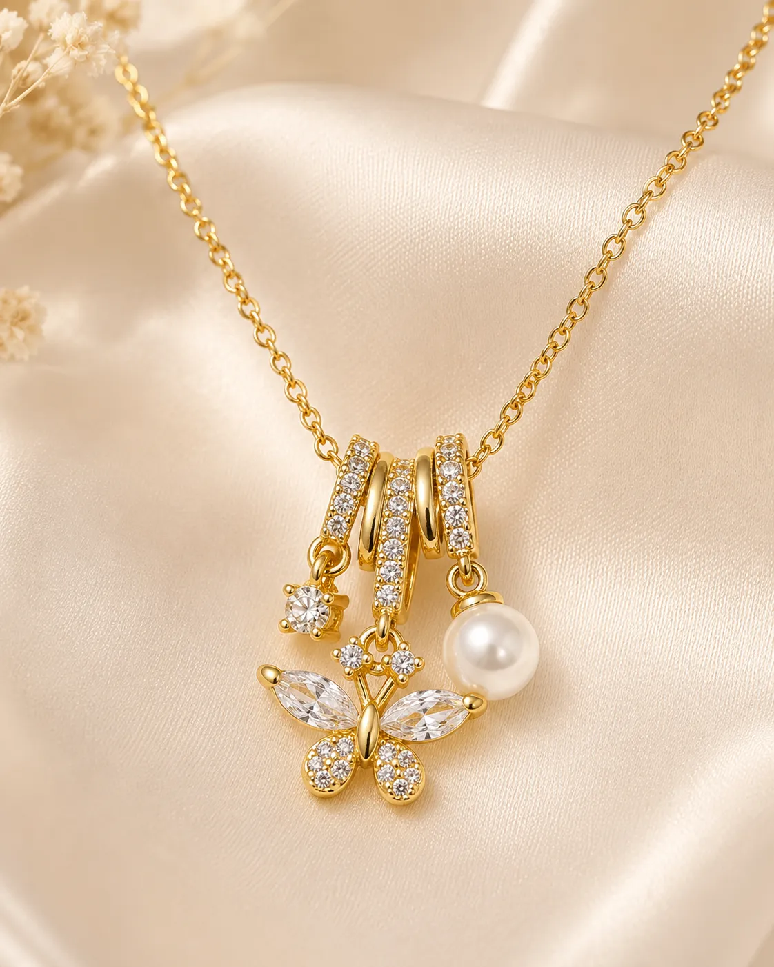 Golden Butterfly Crystal Necklace Golden Butterfly Crystal Necklace featuring sparkling butterfly crystals, pearl charm, and gold finish