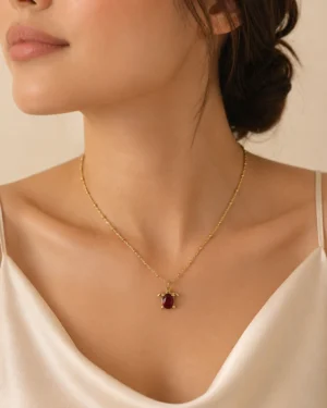 Ruby Turtle Pendant Necklace featuring a brilliant ruby-red crystal in a premium gold turtle design