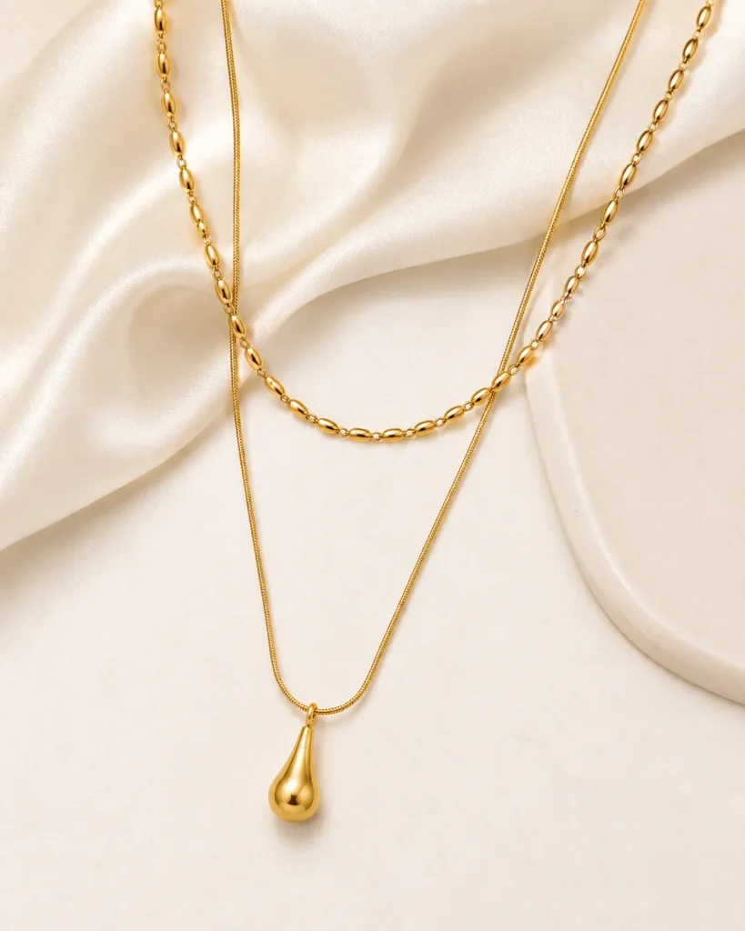 Golden teardrop layered necklace with oval link chain